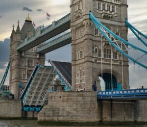 Captivating image of Tower Bridge in London with its iconic drawbridge raised.